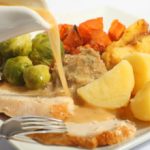 Food being smothered with gravy