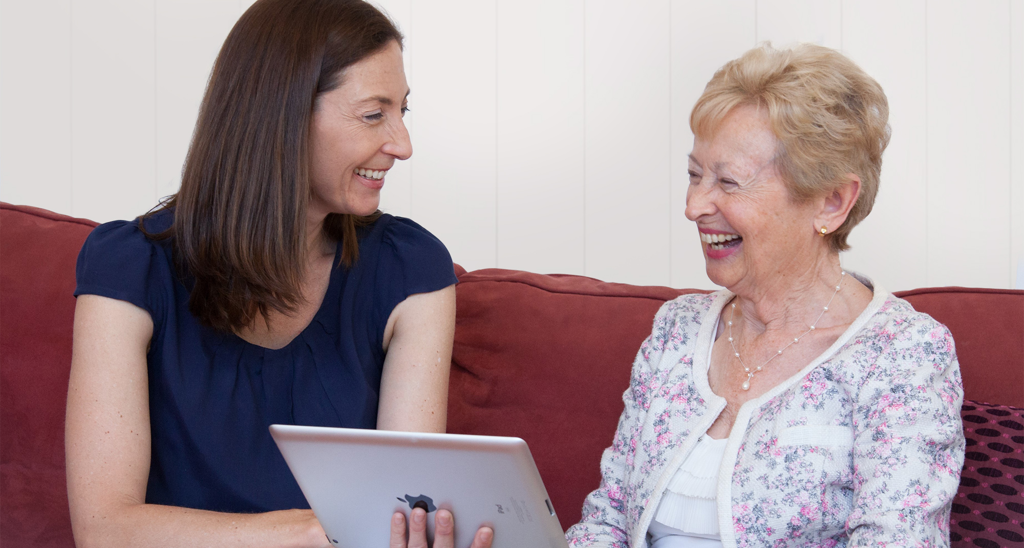 Speech Pathologist, Bernadette Dutton, laughing with an elderly woman